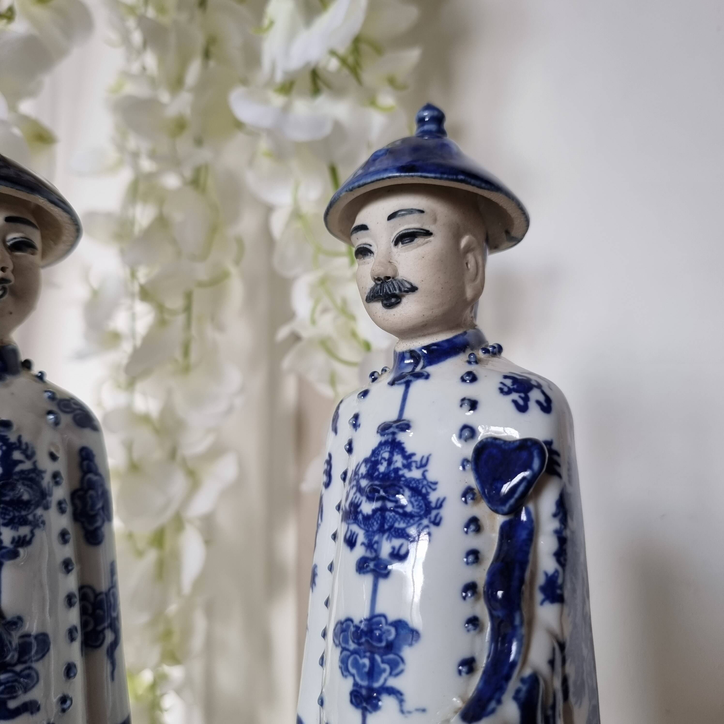 Pair of vintage Chinese blue and white porcelain figurines depicting