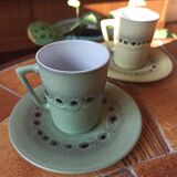 A pair of vintage glazed stoneware cups and saucers.
