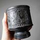 Small Greek pot in black terracotta with animal decoration, craftsmanship from 1960-80.