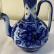 Glazed ceramic carafe with floral decoration