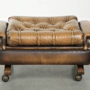 Elegant cowhide English chesterfield ottoman finished with decorative nails