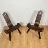 Pair of low tripod chairs in solid wood, mid-20th century.