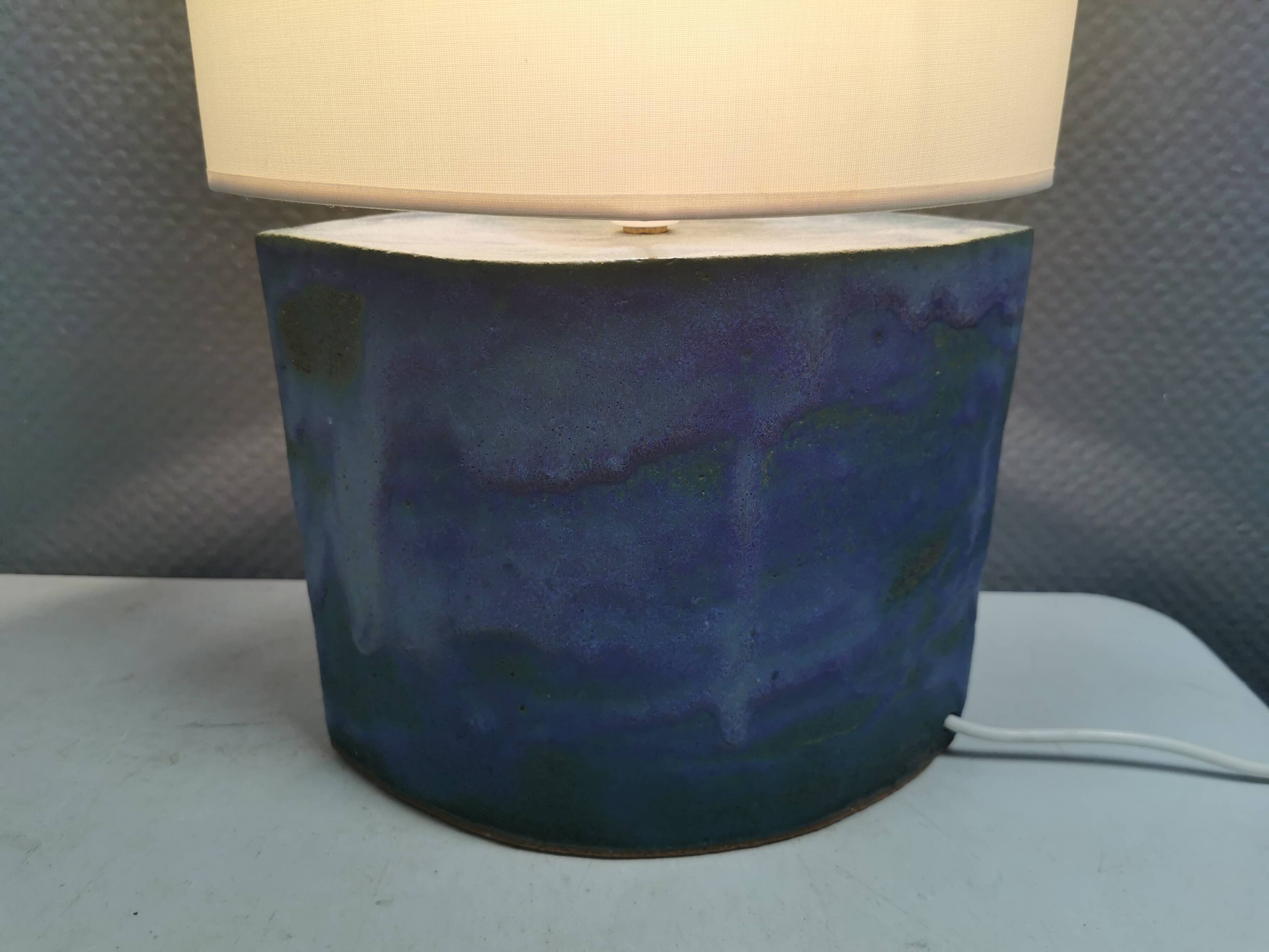 Sculptural table lamp in blue glaze with an abstract expression.