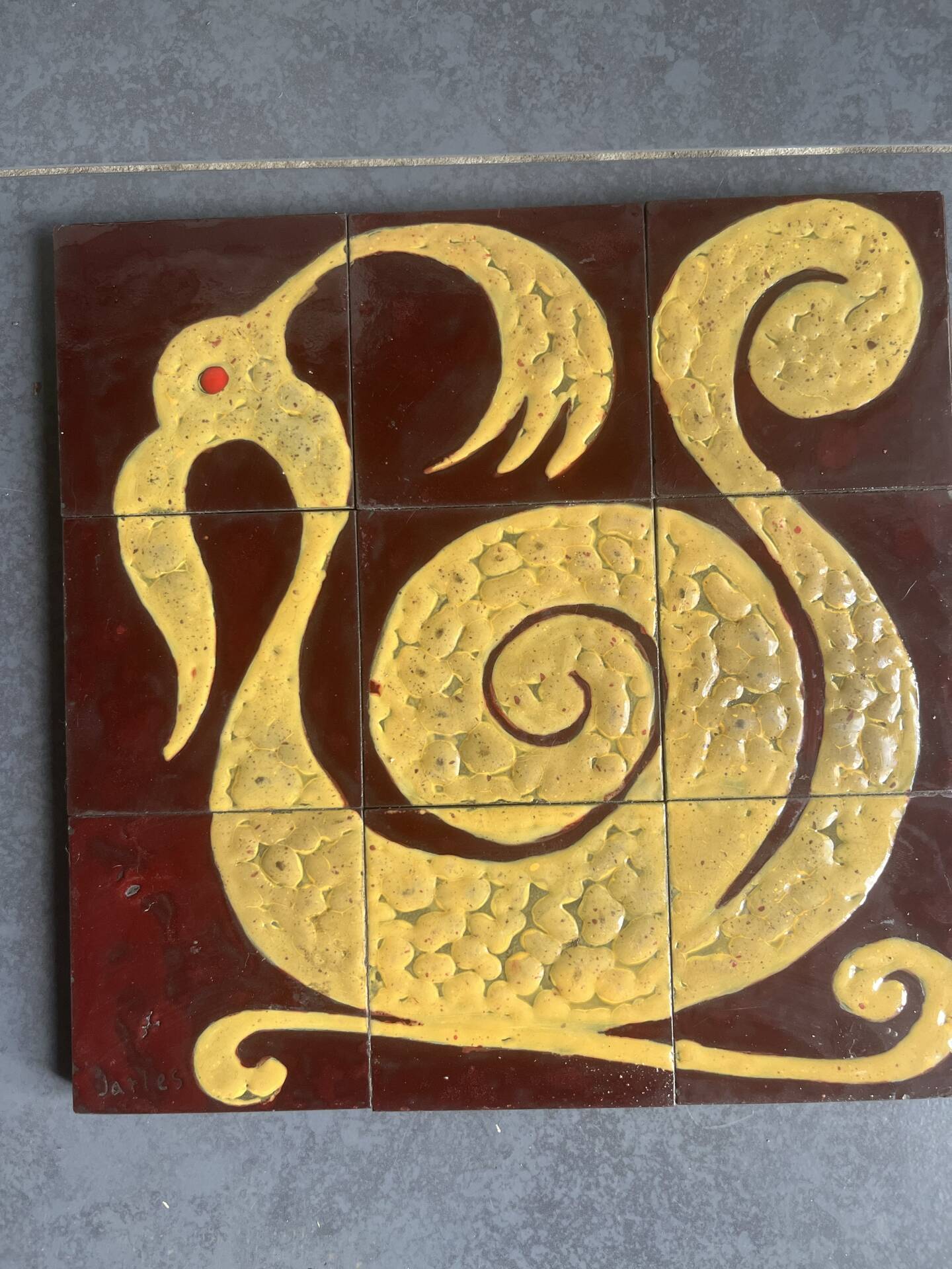 Ceramic plaque with zoomorphic pattern made up of 9 tiles.