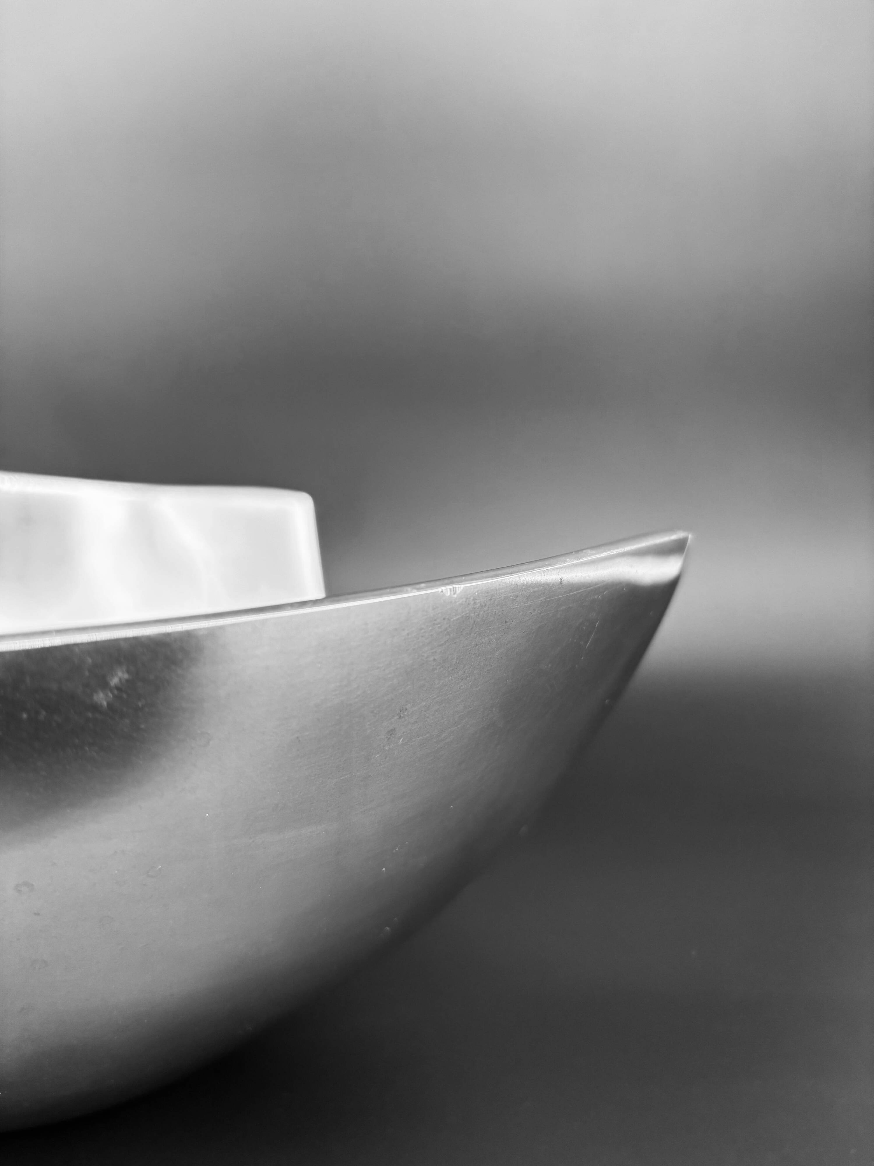 Sculptural polished aluminium bowl, in the style of Michael Lax, 1970s.