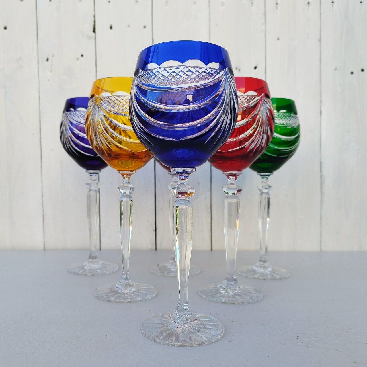Six vintage coloured cut crystal wine glasses