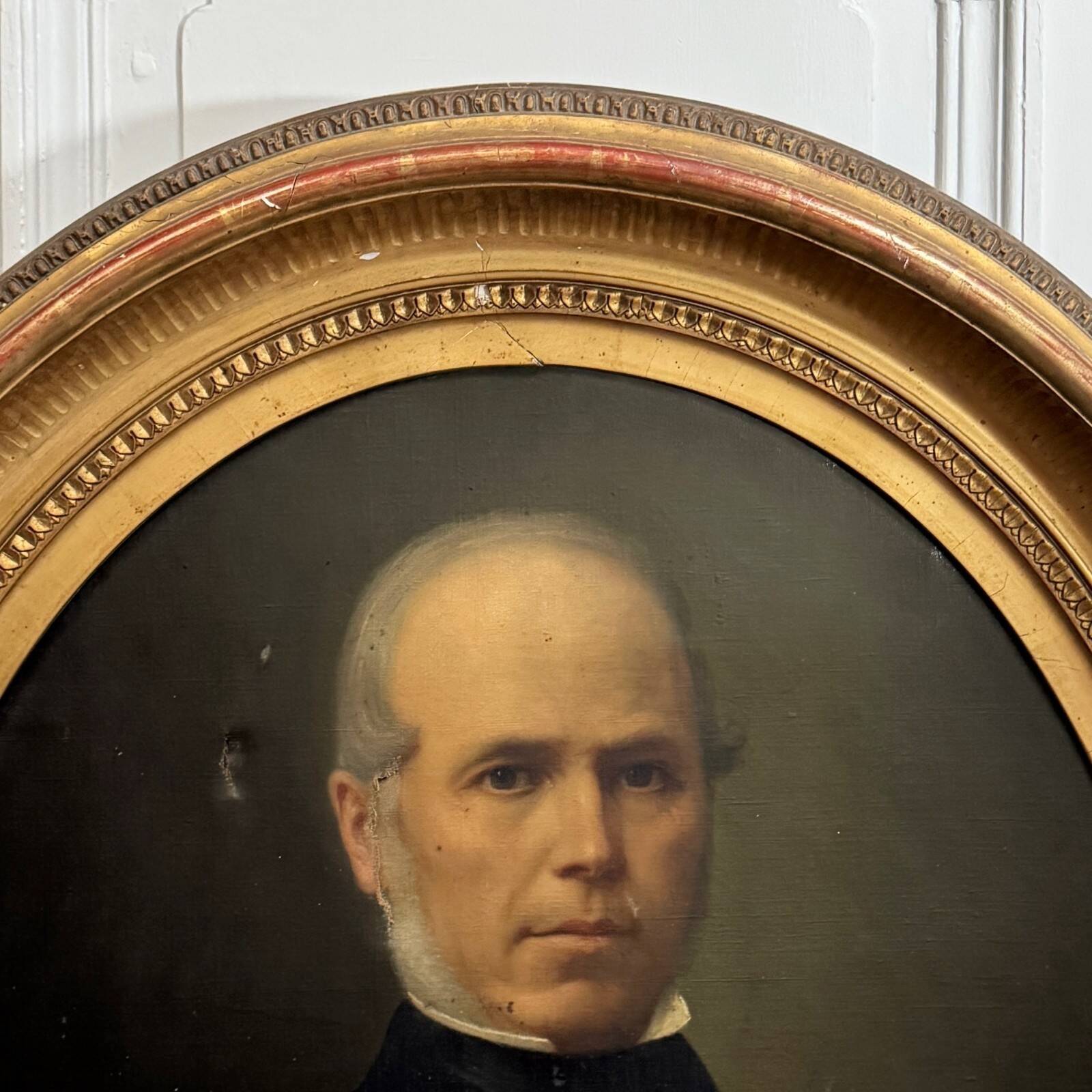 Oil on canvas portrait of a man, late 19th century, oval frame gilded with gold leaf.