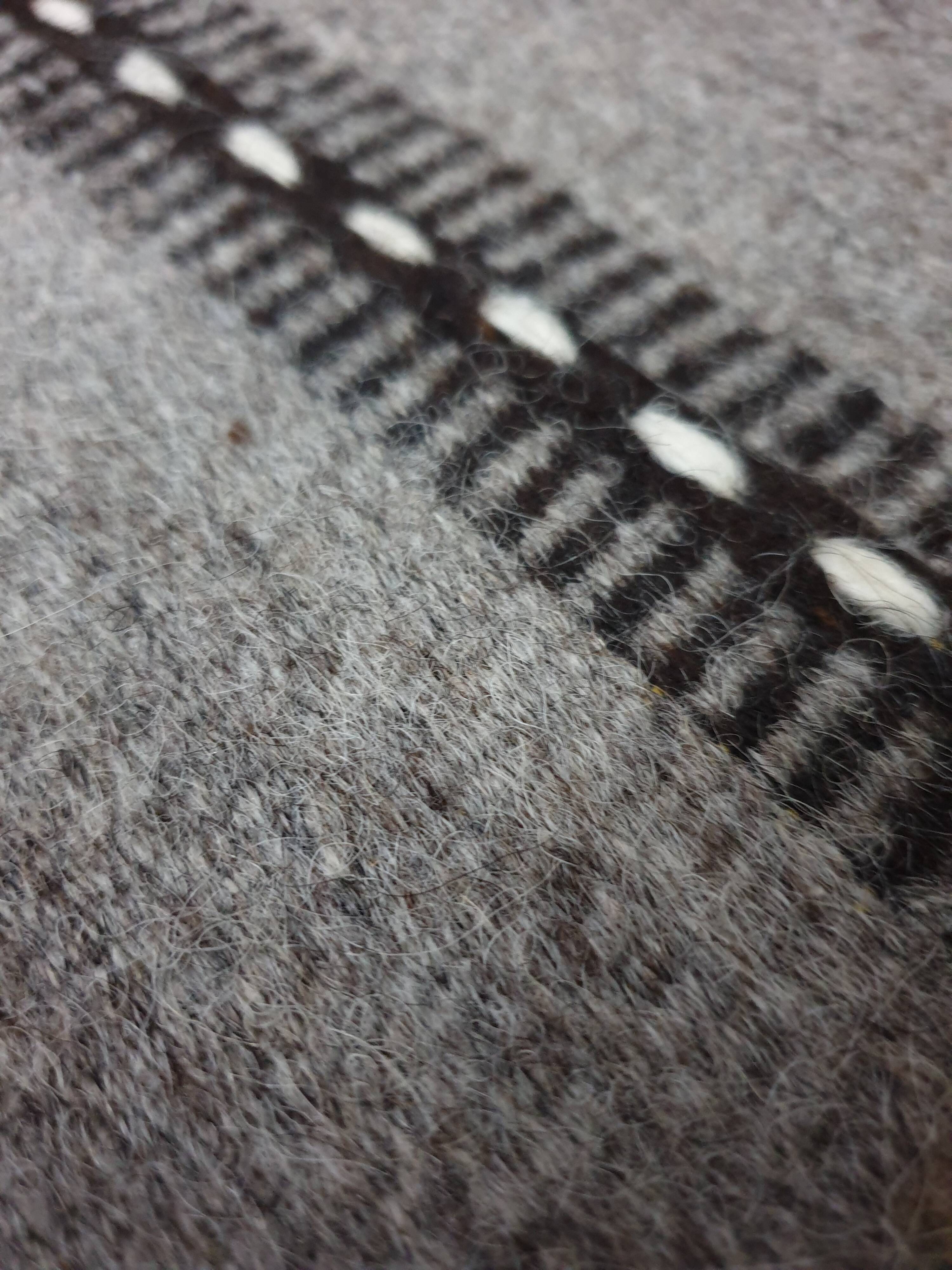Handwoven vintage geometrical rug, grey background