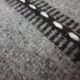Handwoven vintage geometrical rug, grey background