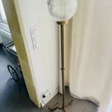 Floor lamp in gilded brass and round glass globe