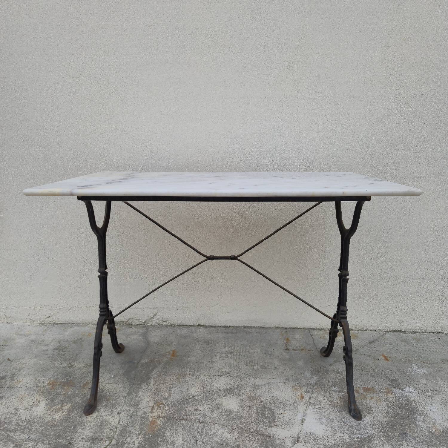 Antique cast iron and marble bistro restaurant table