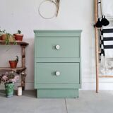 Old chest of drawers with two green drawers