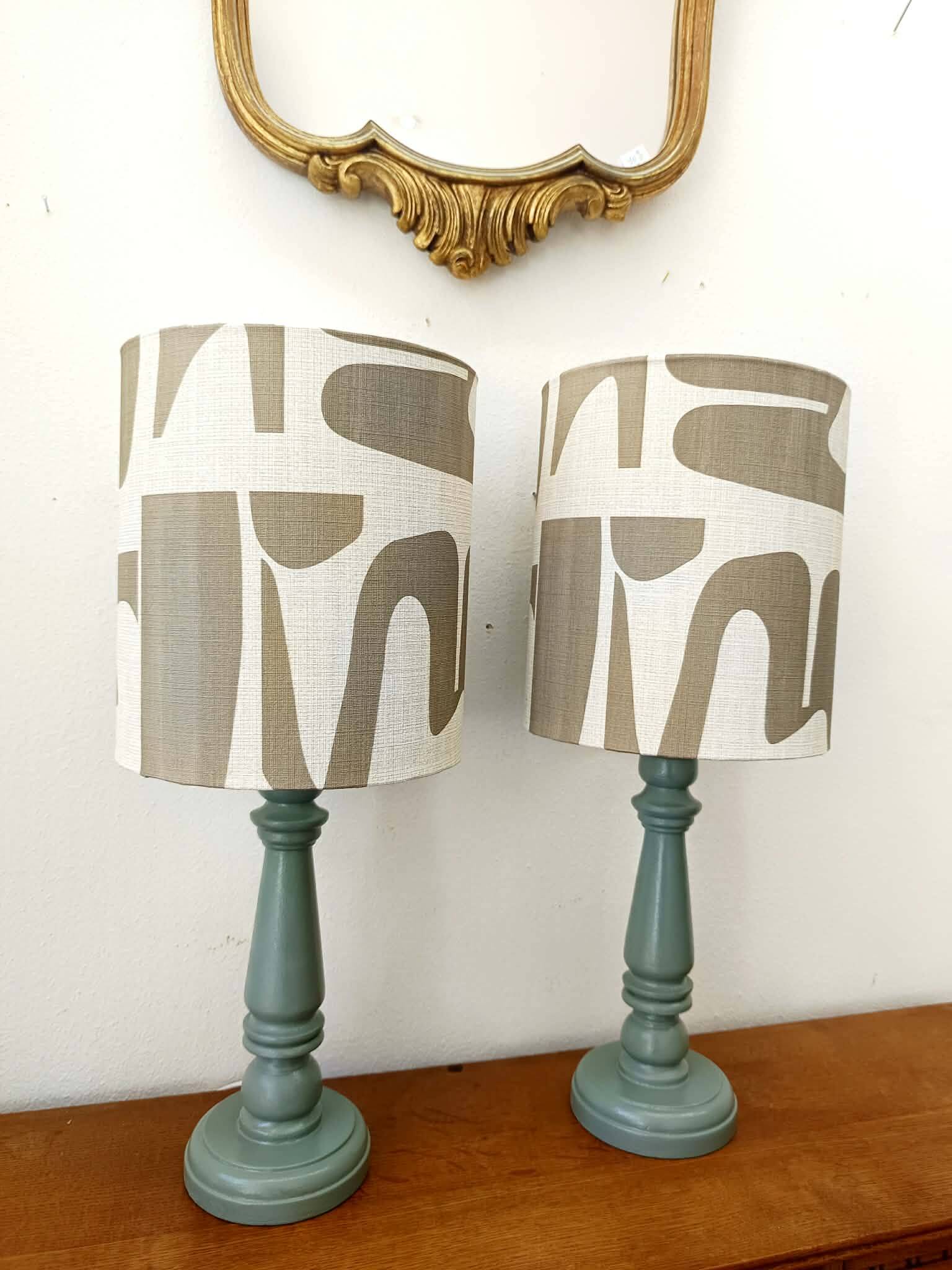 Pair of wooden lamps with custom modernist lampshades.