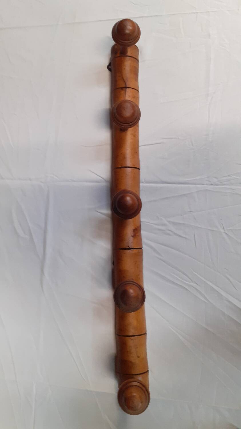 Wooden wall coat rack