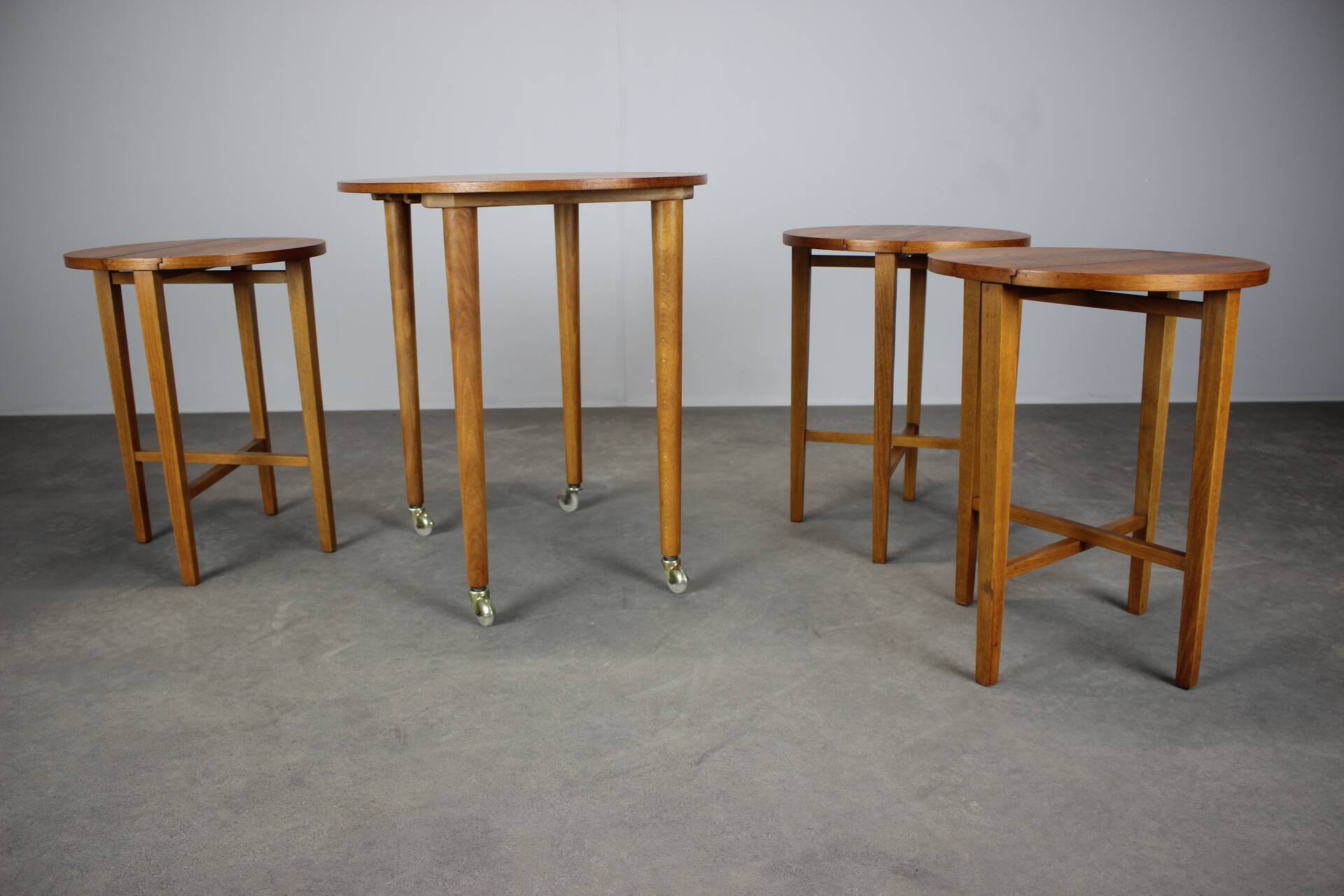 Restored Danish folding teak table with three nesting chairs by Poul Hundevad