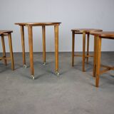 Restored Danish folding teak table with three nesting chairs by Poul Hundevad