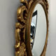 Ancient witch's eye mirror Dollanzo Italy in gilded wood