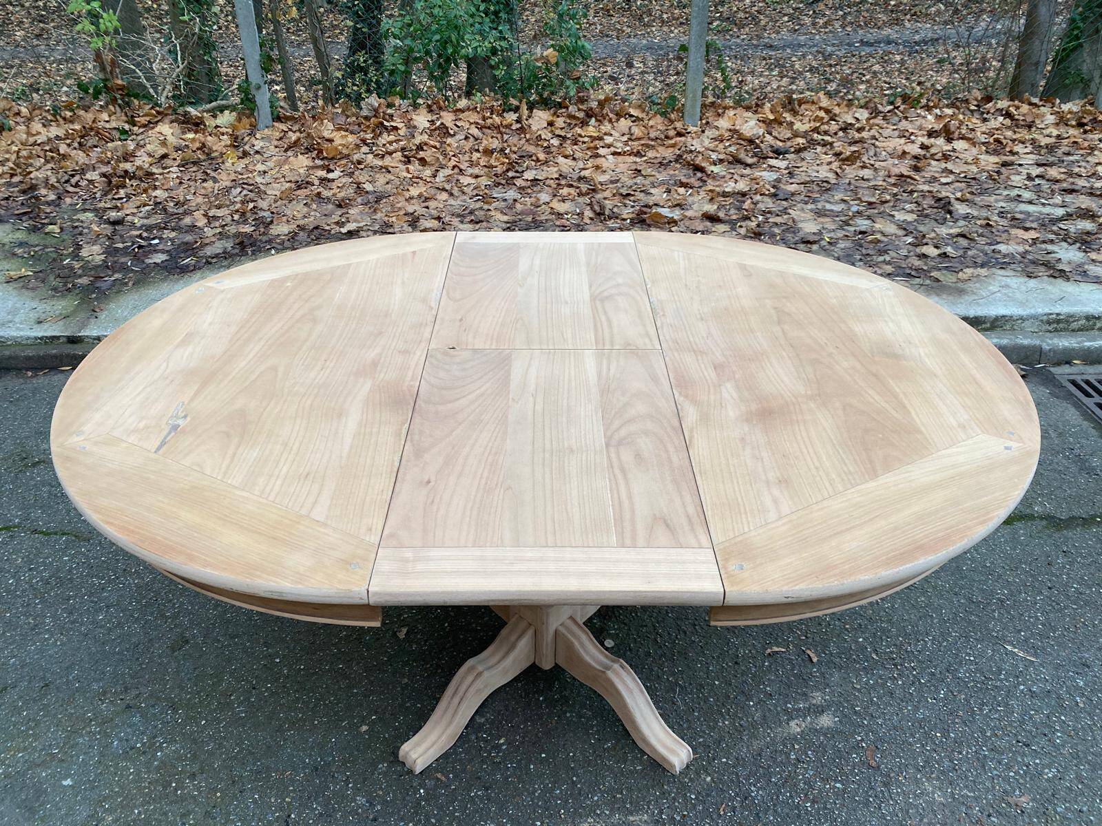 Round extendable dining table with a central pedestal base, renovated in raw wood, 150cm