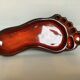 Red ceramic footprint catchall.