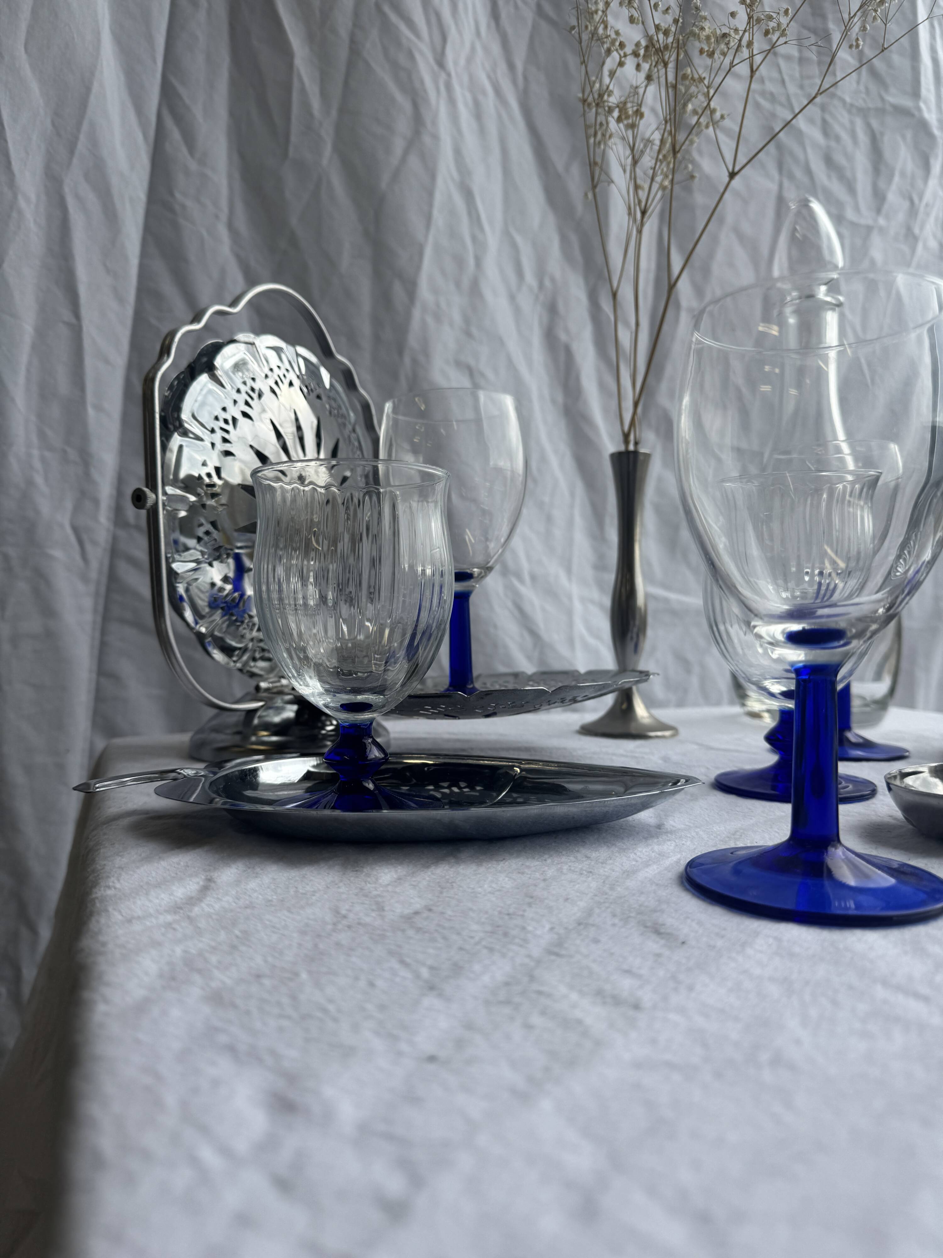 Set of 3 large blue stemmed glasses and 3 small blue stemmed glasses