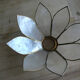 Brass chandelier and flowers in mother-of-pearl petals