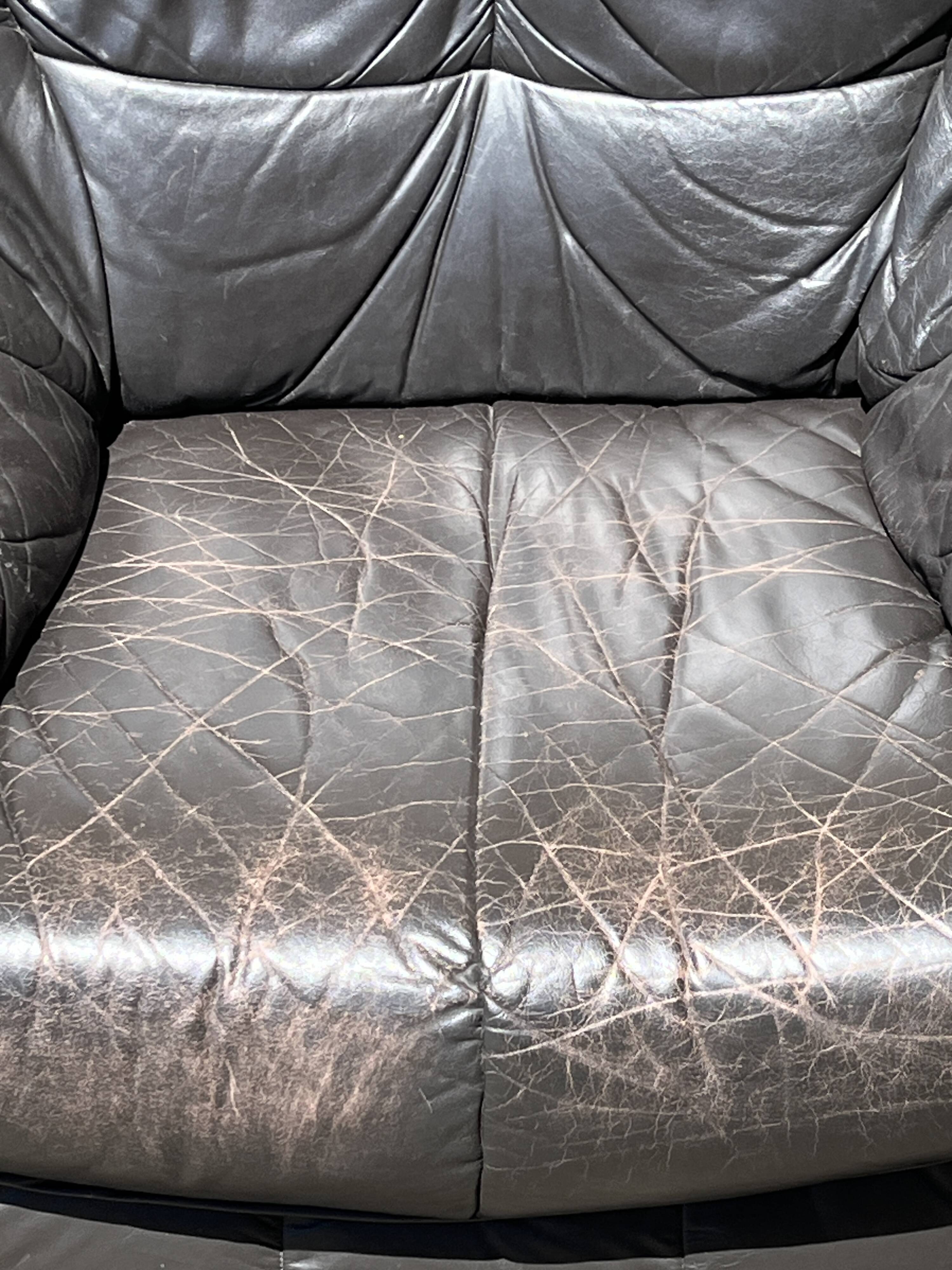 Pair of patinated leather club armchairs