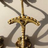 Pair of gilded bronze hooks Louis XVI style, nineteenth century.