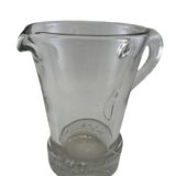 Large stylized glass pitcher