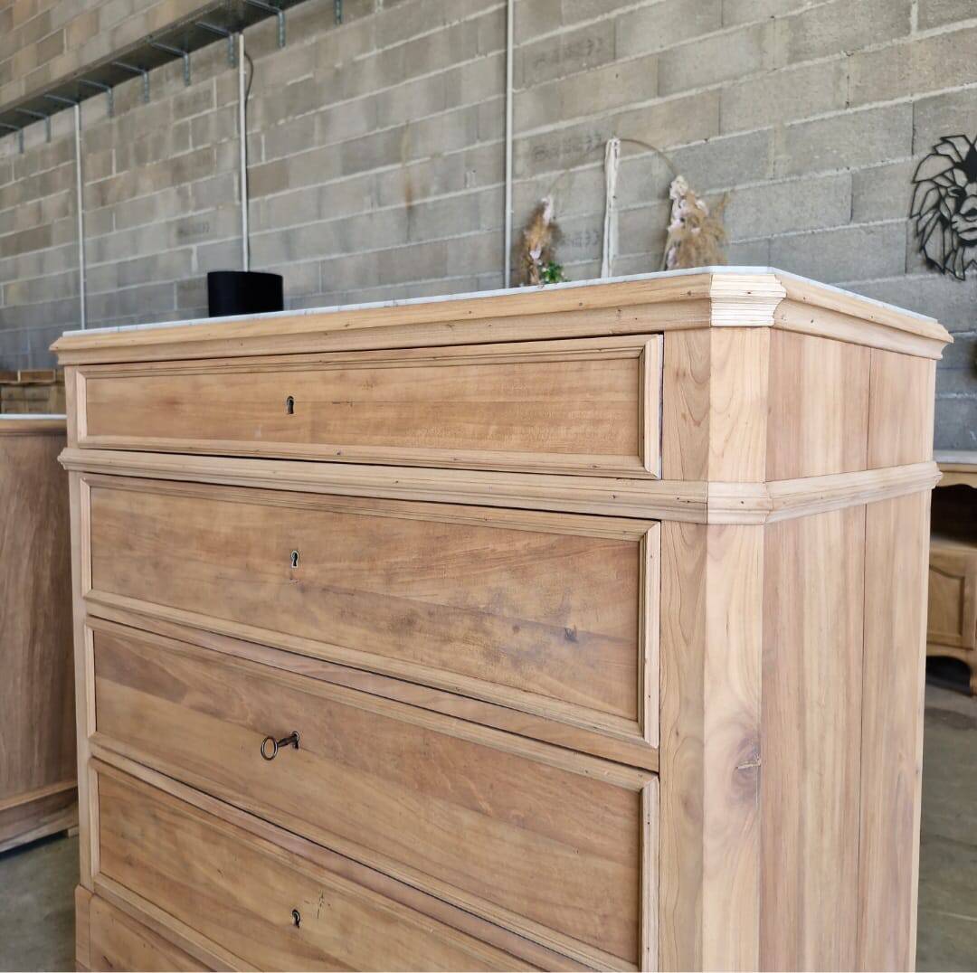 Walnut chest of drawers with white marble.