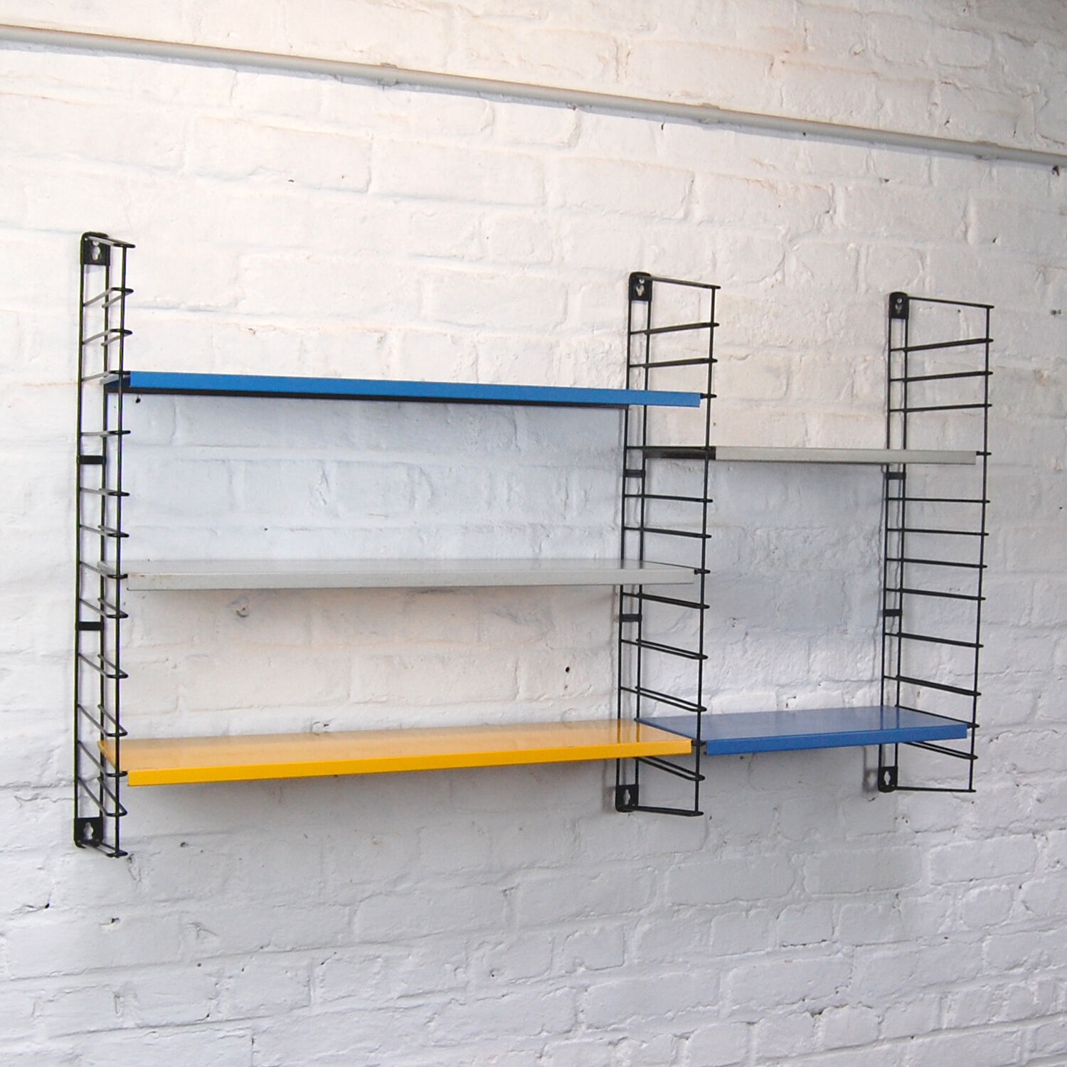 Vintage Tomado wall shelf by A. Dekker 1960s