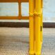 Yellow lacquered console with a flip-top surface by McGuire San Francisco, 1970s.