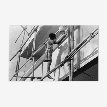 Young Indian perched on a scaffolding