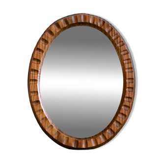 Vintage oval mirror with fluted relief in dark wood color Scandinavian style
