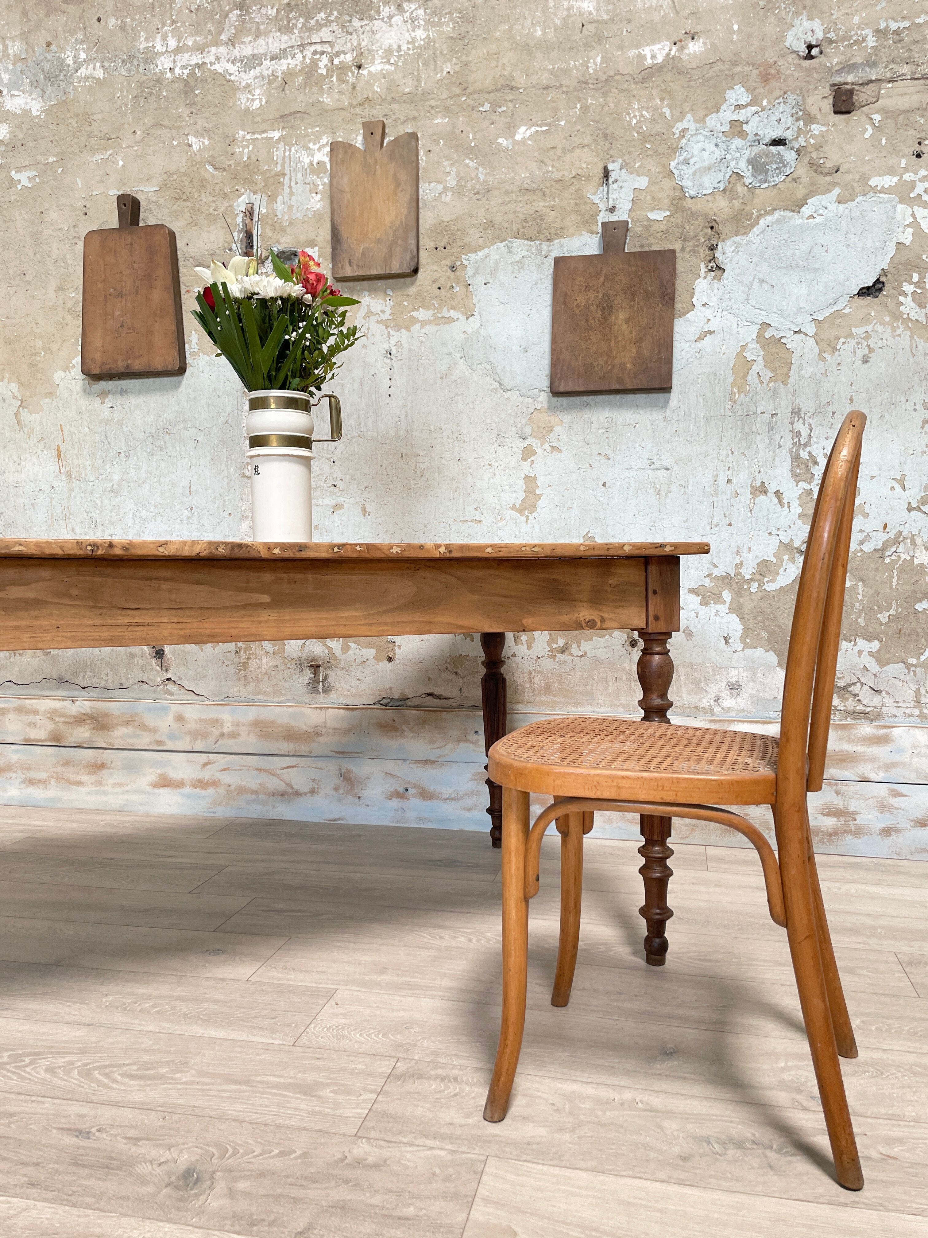 Vintage farmhouse table with turned legs.