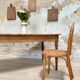 Vintage farmhouse table with turned legs.