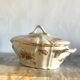 Antique porcelain soup bowl with floral decoration and golden border