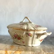 Antique porcelain soup bowl with floral decoration and golden border