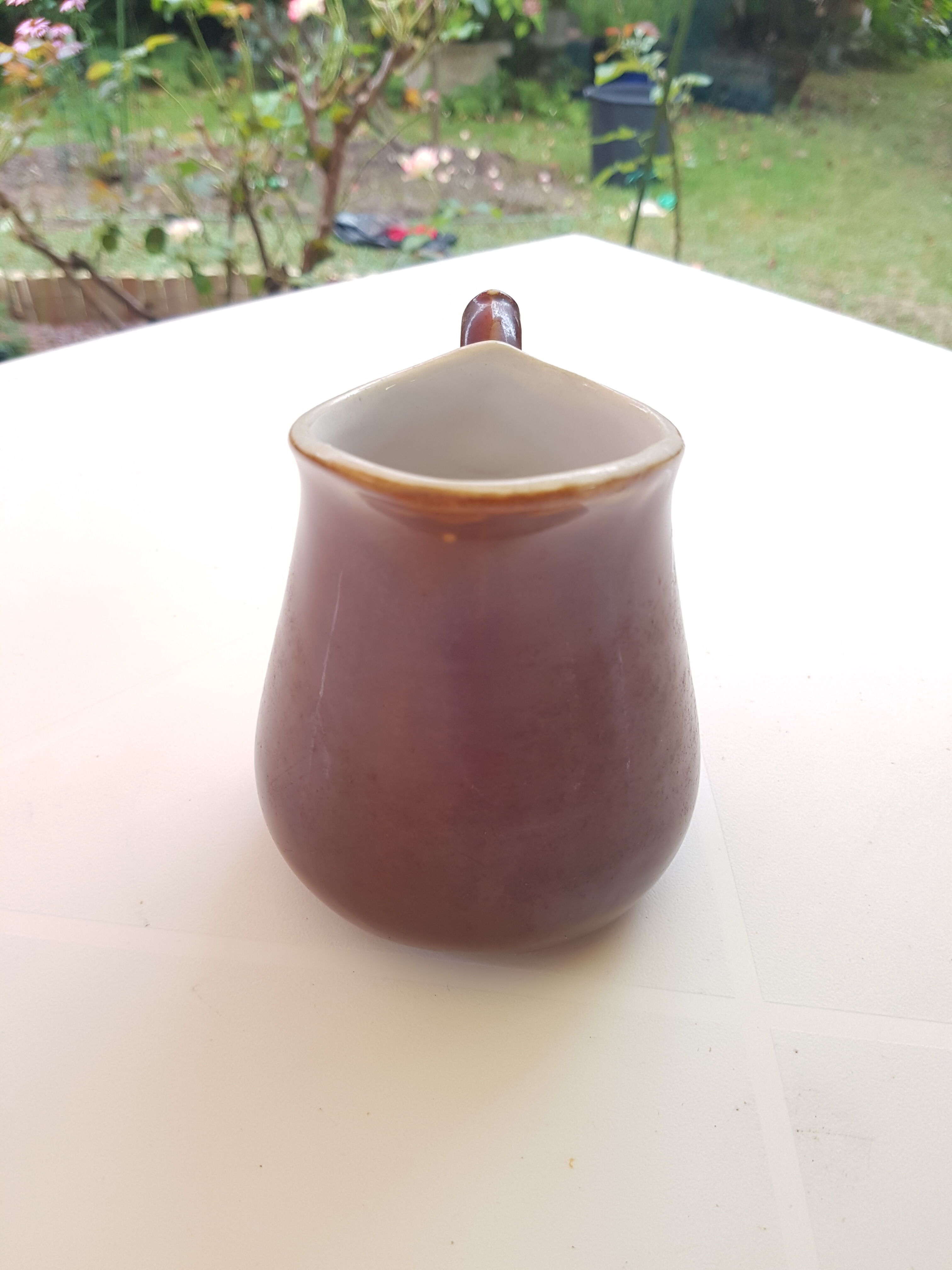 Vintage pitcher in enamelled sandstone from the 1960s
