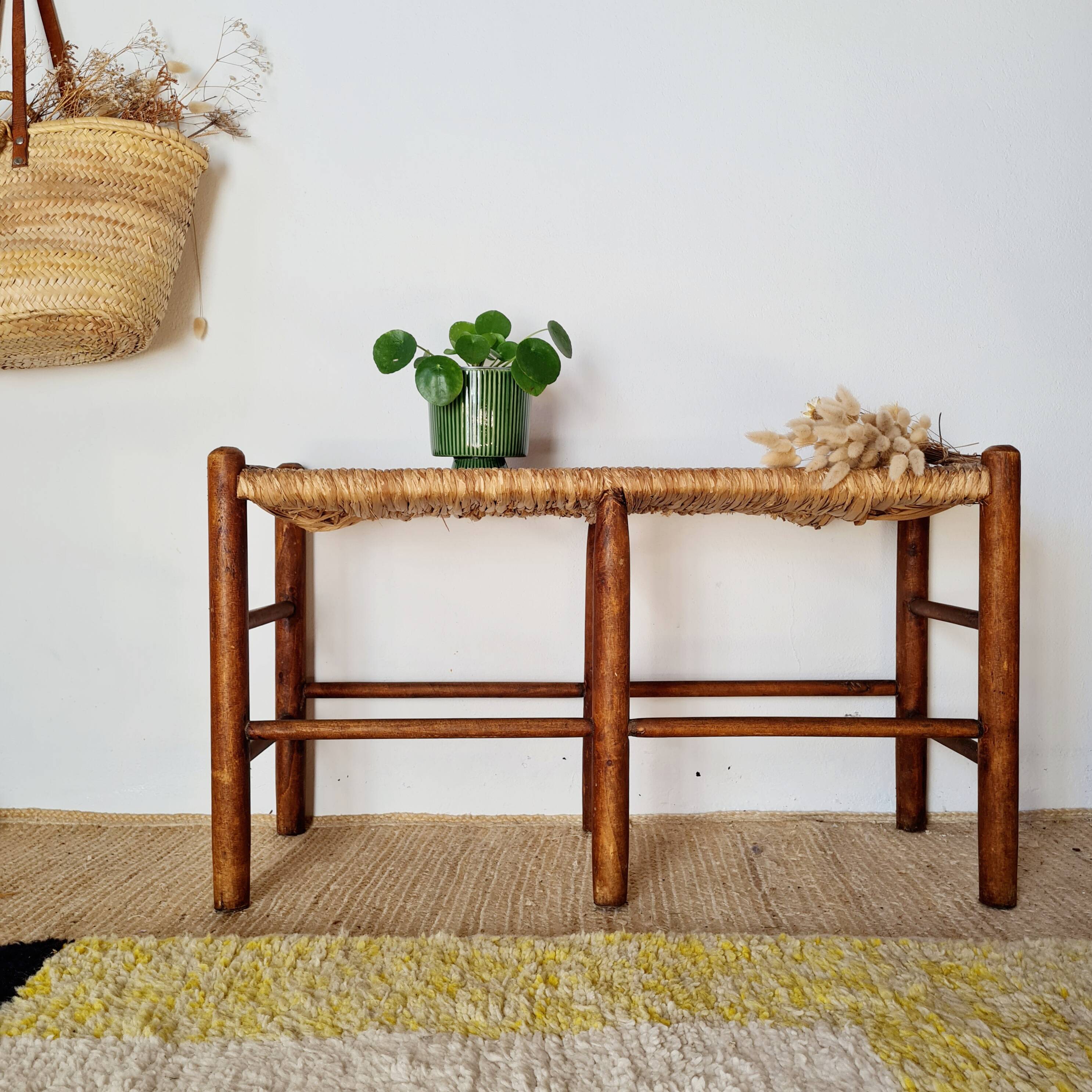 Old wooden and straw bench