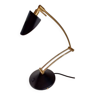 Articulated black and gold metal desk lamp