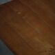 Solid oak dining table with cross base by Danish cabinetmaker, mid-20th century.