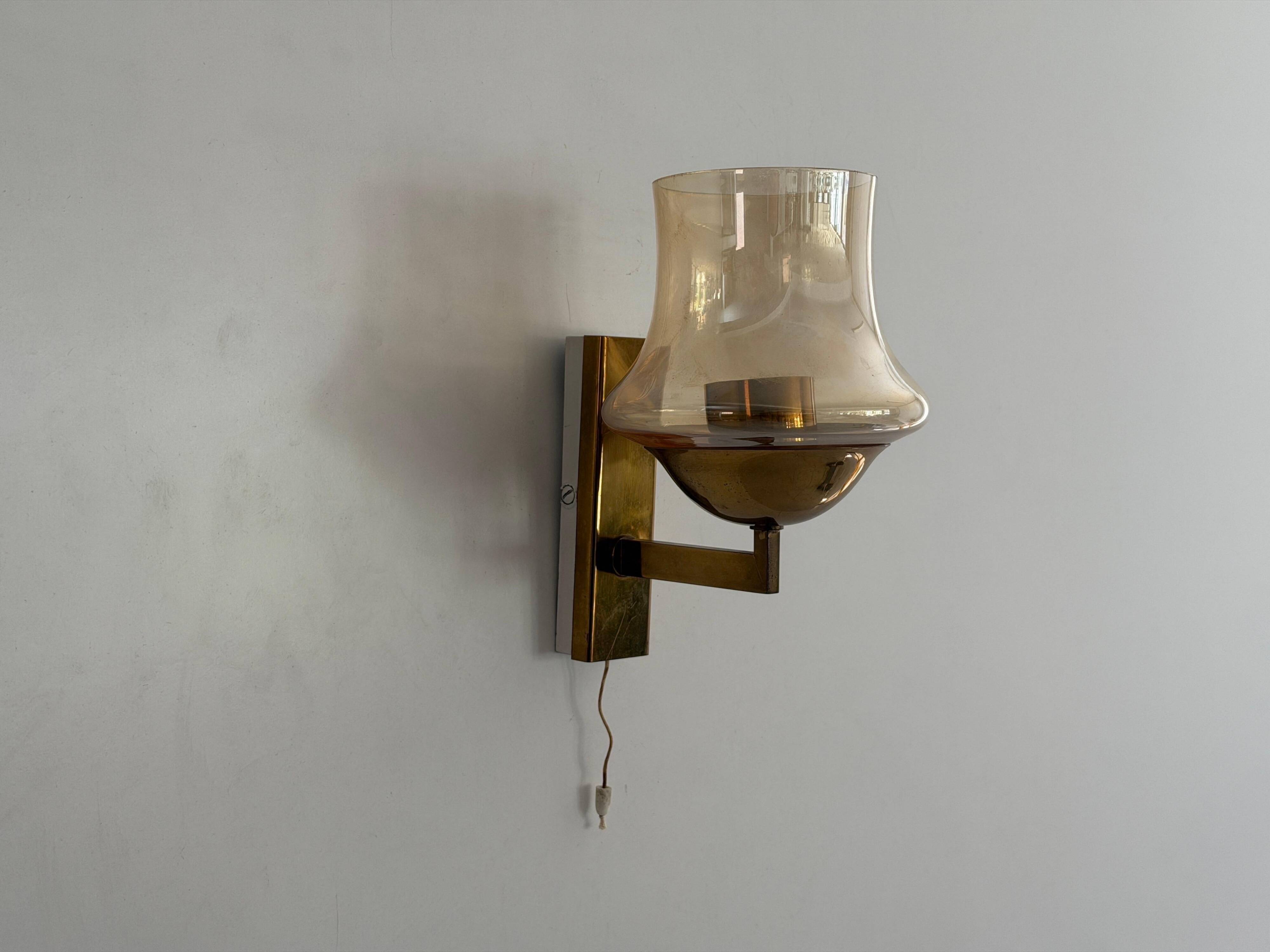 Yellow glass and brass wall light from the mid-century, 1960, Germany.