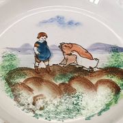 Large antique hollow dish from the 19th century, earthenware with pastoral decoration featuring a child, pig, and goose.