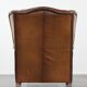 Cognac-coloured wingback armchair in English style made of cowhide leather