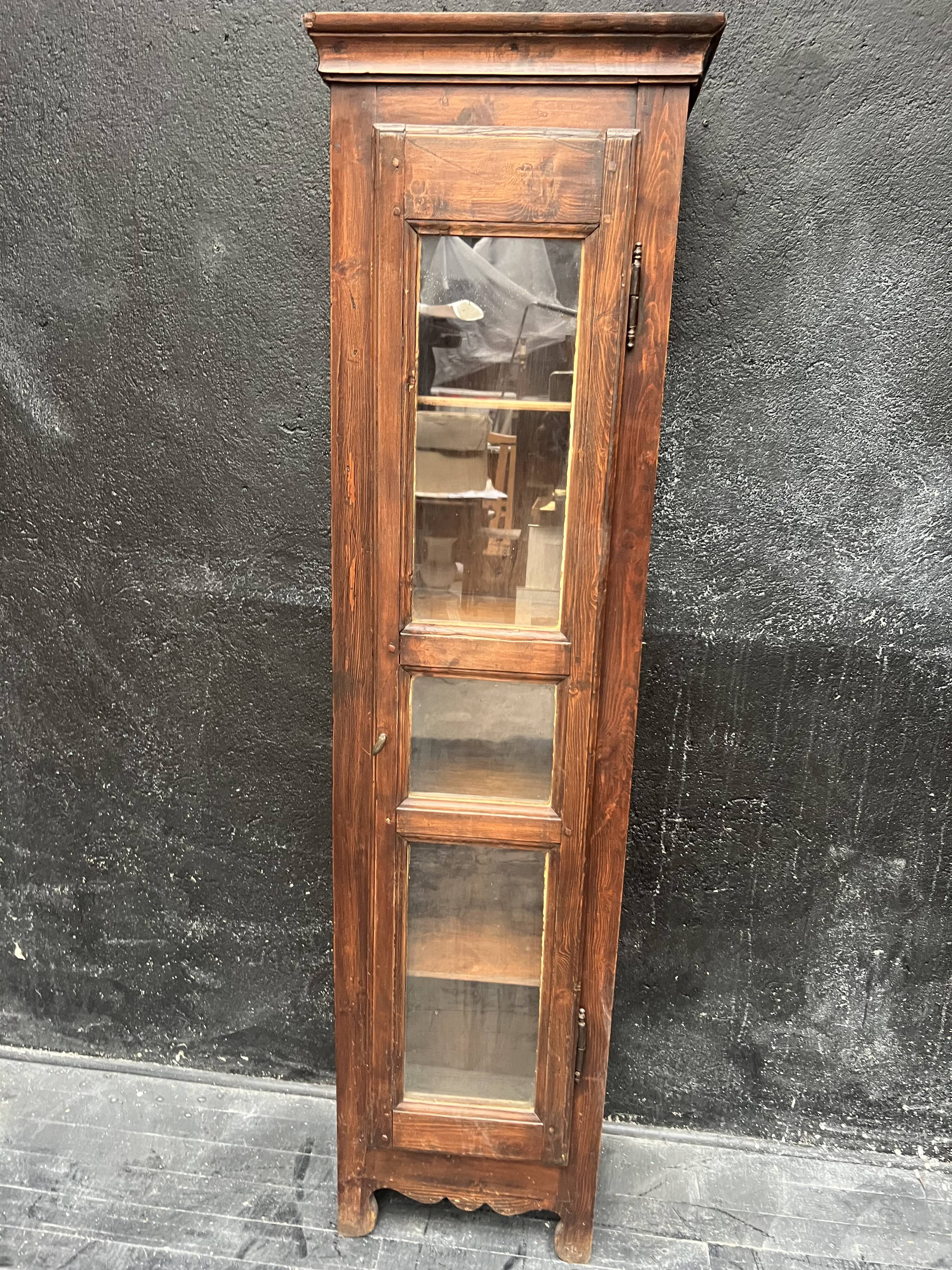 Old narrow wooden showcase.