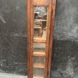 Old narrow wooden showcase.