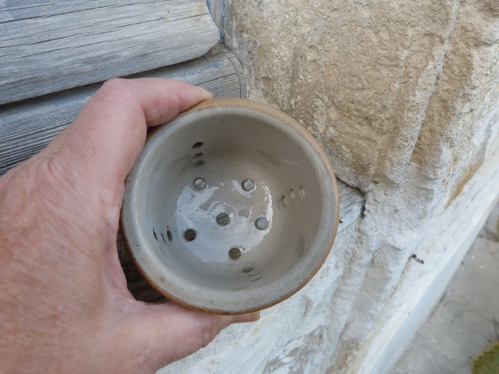 Vintage cheese draining pot in antique stoneware