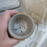 Vintage cheese draining pot in antique stoneware