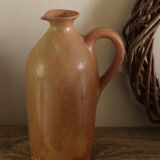 Vintage stoneware liqueur bottle with handle