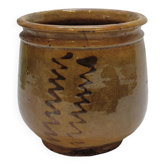 Old jar pot in glazed terracotta